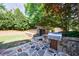 Backyard featuring stone patio, built-in grill, and hot tub area at 2141 Abby Ne Ln, Atlanta, GA 30345