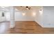 Finished basement space features hardwood-style flooring, modern lighting, and a decorative column at 2141 Abby Ne Ln, Atlanta, GA 30345