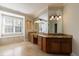Bathroom featuring double vanity with granite countertops, storage, and tiled floors at 2141 Abby Ne Ln, Atlanta, GA 30345