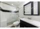 Modern bathroom with glass shower, decorative tile, updated vanity, and sleek fixtures at 2141 Abby Ne Ln, Atlanta, GA 30345