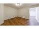 Bright bedroom features sleek hardwood-style flooring, fresh white walls, and modern trim at 2141 Abby Ne Ln, Atlanta, GA 30345
