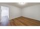 Bright bedroom features sleek hardwood-style flooring, fresh white walls, and modern trim at 2141 Abby Ne Ln, Atlanta, GA 30345