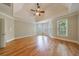 Primary bedroom featuring trey ceiling, fan, hardwood flooring, and plantation shutters at 2141 Abby Ne Ln, Atlanta, GA 30345