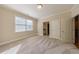 Spacious bedroom featuring carpet floors, neutral walls, natural light and access to bath and hallway at 2141 Abby Ne Ln, Atlanta, GA 30345