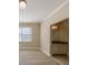 Bright bedroom with a vanity, neutral paint, carpet floors, and a large window offering lots of natural light at 2141 Abby Ne Ln, Atlanta, GA 30345