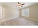 Bedroom features plush carpeting, neutral paint, and a view of the yard through a window at 2141 Abby Ne Ln, Atlanta, GA 30345