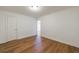 Bedroom with hardwood-style floors, white trim, and fresh neutral paint at 2141 Abby Ne Ln, Atlanta, GA 30345