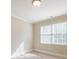 Sunlit bedroom features neutral walls, carpet floors, white trim, and two large windows for ample natural light at 2141 Abby Ne Ln, Atlanta, GA 30345