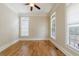 Bright, empty bedroom featuring hardwood floors, crown molding, and large windows offering abundant natural light at 2141 Abby Ne Ln, Atlanta, GA 30345