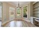 Bright breakfast nook with backyard access, ample sunlight, and built-in shelving at 2141 Abby Ne Ln, Atlanta, GA 30345
