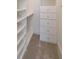 Walk-in closet with custom shelving and drawers at 2141 Abby Ne Ln, Atlanta, GA 30345