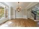 Formal dining room with hardwood floors, large windows, and elegant chandelier at 2141 Abby Ne Ln, Atlanta, GA 30345