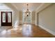 Elegant dining room with hardwood floors, wainscoting, and a decorative chandelier at 2141 Abby Ne Ln, Atlanta, GA 30345
