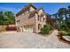 Exterior facade view featuring a brick home with an attached two-car garage, and landscaped surroundings at 2141 Abby Ne Ln, Atlanta, GA 30345