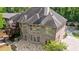 Elegant two-story brick home showcasing a beautiful stone patio and manicured lawn at 2141 Abby Ne Ln, Atlanta, GA 30345