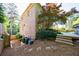 Exterior view of a brick house and fenced-in yard with trees at 2141 Abby Ne Ln, Atlanta, GA 30345