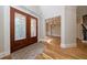 Elegant foyer with hardwood floors, staircase, and decorative glass front doors at 2141 Abby Ne Ln, Atlanta, GA 30345