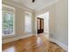 Bright foyer featuring hardwood floors and a stained glass front door with sidelight windows and neutral paint at 2141 Abby Ne Ln, Atlanta, GA 30345