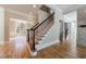 Elegant foyer with hardwood floors, staircase and chandelier boasts luxury with views to the dining and living areas at 2141 Abby Ne Ln, Atlanta, GA 30345