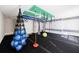 Home gym with ceiling mounted apparatus, climbing wall, gym rings, and padded flooring at 2141 Abby Ne Ln, Atlanta, GA 30345