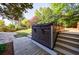 Backyard with hot tub sitting on a wooden deck with trees and grass at 2141 Abby Ne Ln, Atlanta, GA 30345