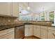 Well-lit kitchen featuring granite counters, brick backsplash, stainless steel appliances, and abundant cabinetry at 2141 Abby Ne Ln, Atlanta, GA 30345