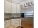 Kitchen with ample storage, stainless steel refrigerator, granite counters, and tiled backsplash at 2141 Abby Ne Ln, Atlanta, GA 30345