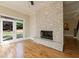 Bright living area featuring a fireplace, hardwood floors, natural light, and glass doors at 2141 Abby Ne Ln, Atlanta, GA 30345