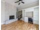 Living room boasts a stone fireplace, hardwood floors, built in bar, and neutral paint at 2141 Abby Ne Ln, Atlanta, GA 30345