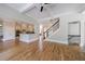 Open-concept living space with hardwood floors, staircase and kitchen offers modern living and easy entertaining at 2141 Abby Ne Ln, Atlanta, GA 30345