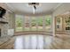 Spacious living room features stone fireplace, hardwood floors, large windows, ceiling fan and bright neutral paint at 2141 Abby Ne Ln, Atlanta, GA 30345