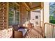Inviting covered porch featuring comfortable seating and brick flooring at 2141 Abby Ne Ln, Atlanta, GA 30345