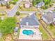 An aerial showcases a home's private pool, outdoor entertainment area, and well-manicured backyard at 3229 Summer Stream Nw Ln, Kennesaw, GA 30152