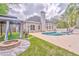 This backyard features a sparkling pool, gazebo, fire pit and lush lawn for outdoor entertaining at 3229 Summer Stream Nw Ln, Kennesaw, GA 30152