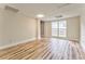 Basement rec room with plank floors and a window at 3229 Summer Stream Nw Ln, Kennesaw, GA 30152