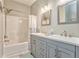Bathroom featuring a shower-tub combo and double sink vanity at 3229 Summer Stream Nw Ln, Kennesaw, GA 30152