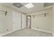 Well-lit carpeted bedroom with storage and closet organizers, featuring a clean and organized space at 3229 Summer Stream Nw Ln, Kennesaw, GA 30152