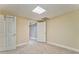 Carpeted bedroom with neutral paint, recessed lighting and view of a doorway to a finished basement at 3229 Summer Stream Nw Ln, Kennesaw, GA 30152