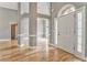 Grand foyer boasts high ceilings, hardwood floors, and a front door with decorative glass, creating an elegant entrance at 3229 Summer Stream Nw Ln, Kennesaw, GA 30152