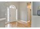 Inviting foyer with a wood floor, featuring a front door with glass sidelights and neutral-toned walls at 3229 Summer Stream Nw Ln, Kennesaw, GA 30152