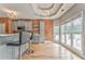 Contemporary kitchen boasts modern appliances, bar seating, brick accent wall, and natural light at 3229 Summer Stream Nw Ln, Kennesaw, GA 30152