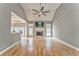 Cozy living room with a fireplace, hardwood floors, neutral paint, and access to the backyard at 3229 Summer Stream Nw Ln, Kennesaw, GA 30152