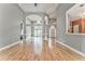 Open concept living room showcasing hardwood floors, an open floor plan, and gray wall paint at 3229 Summer Stream Nw Ln, Kennesaw, GA 30152