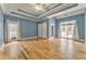 Spacious main bedroom with tray ceiling, ceiling fan and large windows with plenty of natural light at 3229 Summer Stream Nw Ln, Kennesaw, GA 30152