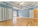 Spacious main bedroom features a tray ceiling, hardwood floors, and access to natural light at 3229 Summer Stream Nw Ln, Kennesaw, GA 30152