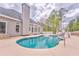 Enjoy the outdoors with this sparkling pool with slide, surrounded by a spacious patio for summer relaxation at 3229 Summer Stream Nw Ln, Kennesaw, GA 30152
