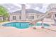 Outdoor swimming pool with slide surrounded by a concrete deck and a landscaped yard at 3229 Summer Stream Nw Ln, Kennesaw, GA 30152