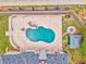 Aerial view of a private pool with a slide, a fire pit, and a gazebo, set within a fenced backyard at 3229 Summer Stream Nw Ln, Kennesaw, GA 30152