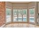 Bright breakfast nook with large windows overlooking the backyard pool with slide and well maintained patio at 3229 Summer Stream Nw Ln, Kennesaw, GA 30152