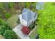An aerial view of a home surrounded by a green lawn and mature trees at 4270 Parnell Rd, Marietta, GA 30062